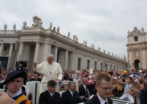 The Pope was always smiling and waving to crowd and sometimes he would stop and hug someone or give them a handshake.